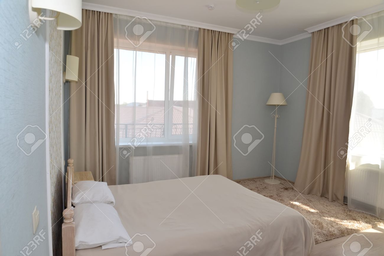 bed in between two windows