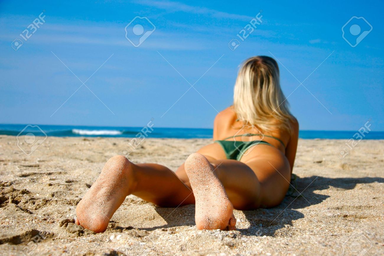 young girl on beach focus on her feet stock photo picture and