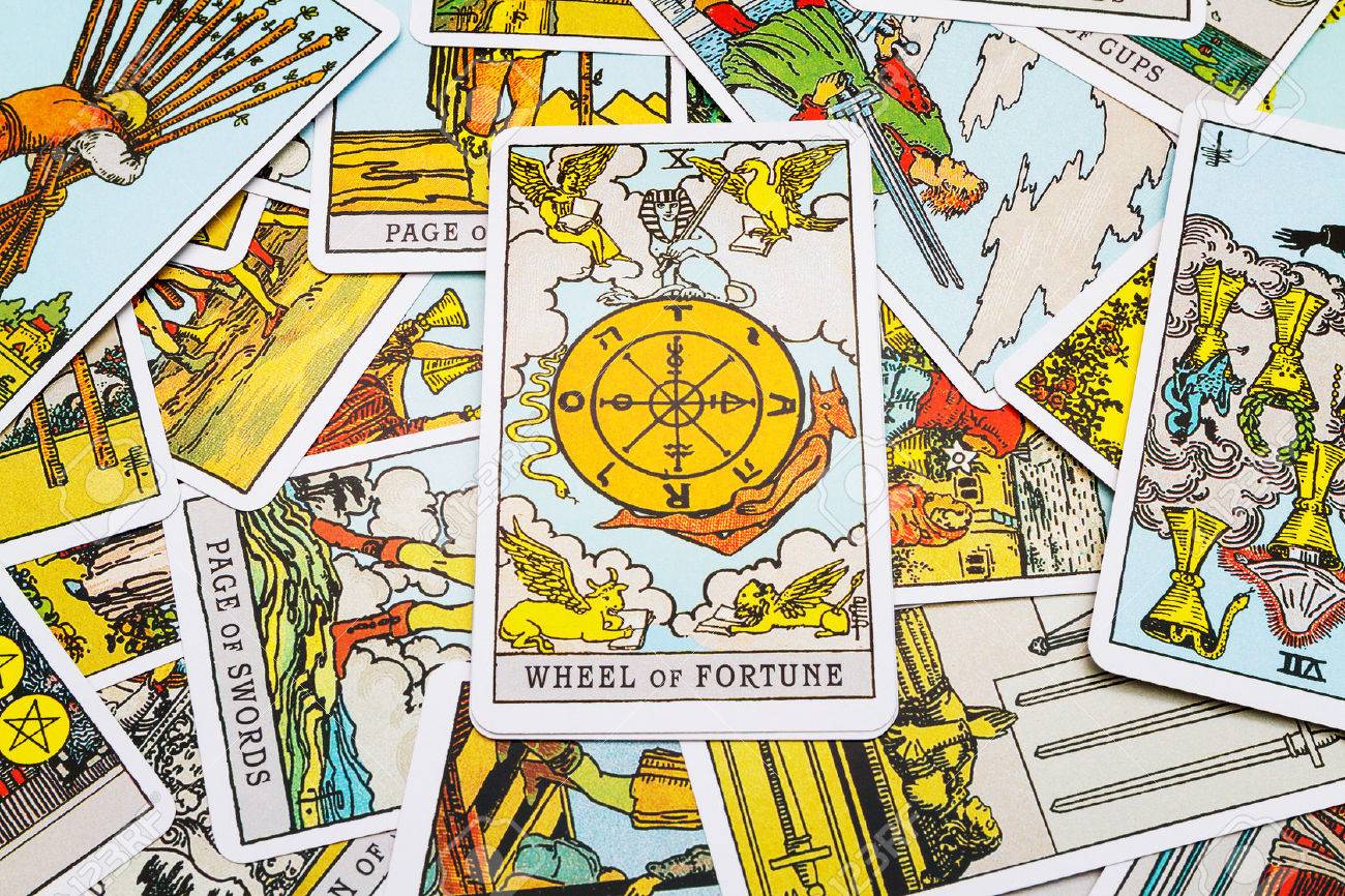 Tarot cards Tarot, the wheel of fortune card in the foreground. - 45132880 Tarot cards Tarot, the wheel of fortune card in the foreground. - 45132880