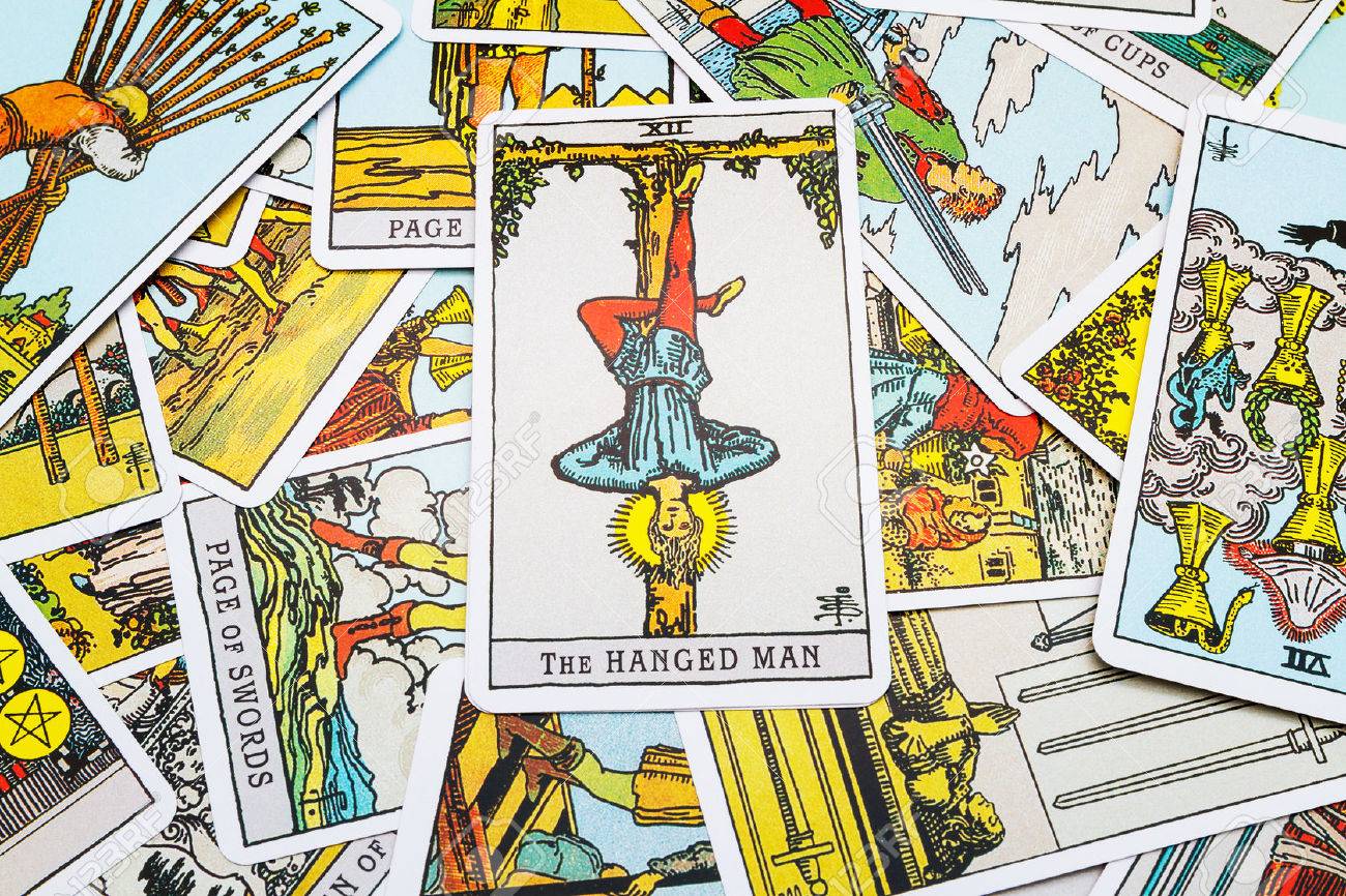 Tarot cards Tarot, the hanged man card in the foreground. - 45132890 Tarot cards Tarot, the hanged man card in the foreground. - 45132890