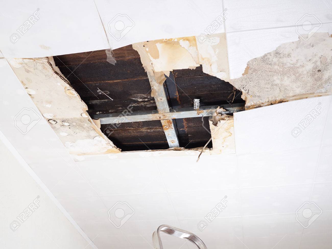 Ceiling panels damaged huge hole in roof from rainwater leakage.Water damaged ceiling . - 57035781 Ceiling panels damaged huge hole in roof from rainwater leakage.Water damaged ceiling . - 57035781