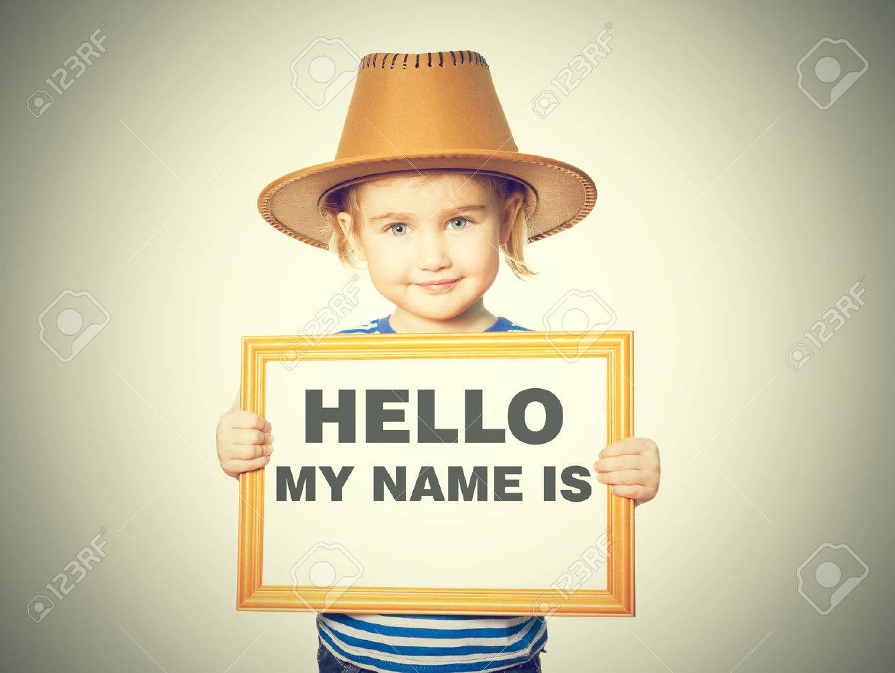 Little Funny girl in striped shirt with blackboard. Text HELLO MY NAME IS. Isolated on white background. - 60897310 Little Funny girl in striped shirt with blackboard. Text HELLO MY NAME IS. Isolated on white background. - 60897310