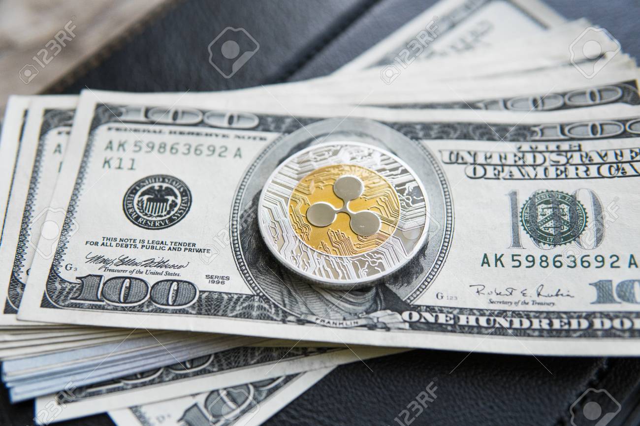 Crypto Currency Ripple Xrp And On Dollars Money Background And Notebook.  Blockchain And Cyber Currency. Global Money. Exchange, Bussiness,  Commercial. Cash Money And Cryptocurrency Concept. Stock Photo, Picture and  Royalty Free Image.