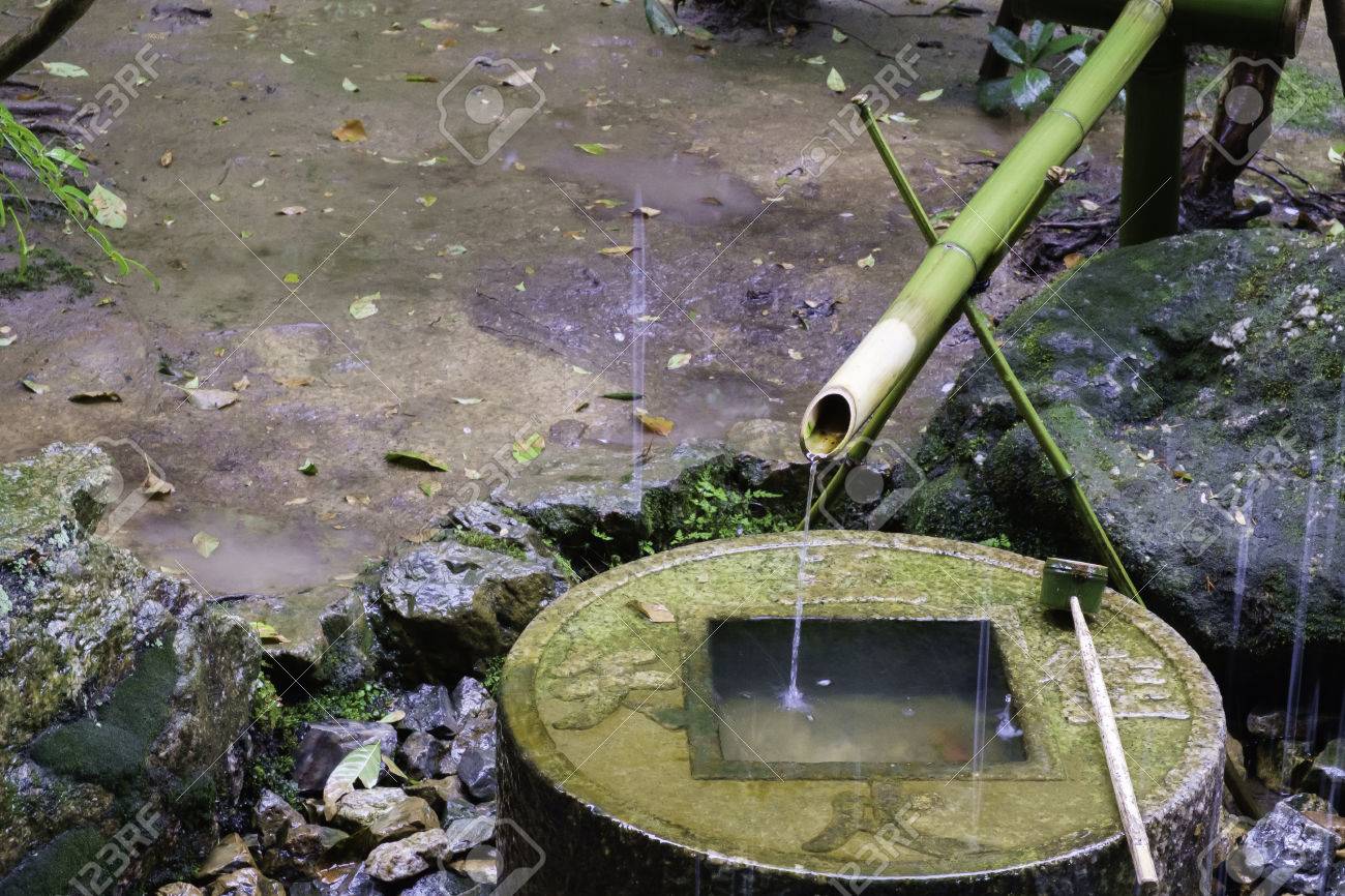 Japanese Bamboo Water Fountain Feature On Round Engrave Lettering Granite Stone Base Container With Rain Drop Japanese Bamboo Water Fountain Feature On Round Engrave Lettering Granite Stone Base Container With Rain Drop