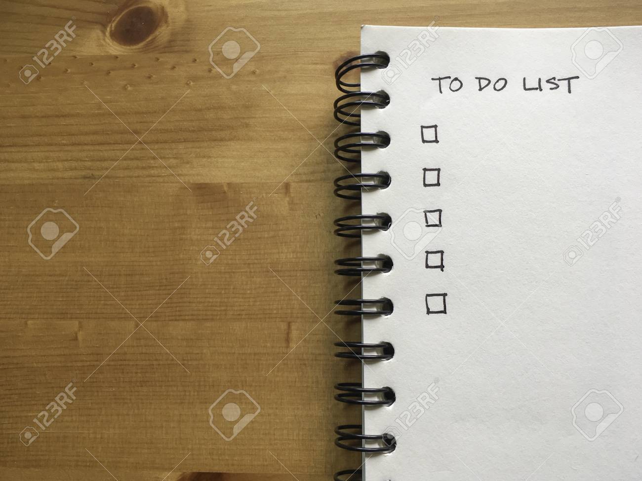 White Paper Note Book With Thing To Do List On Wood Background - 