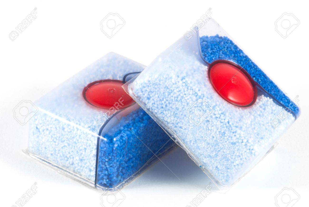 Two dishwasher tablets isolated on white - 13321285 Two dishwasher tablets isolated on white - 13321285