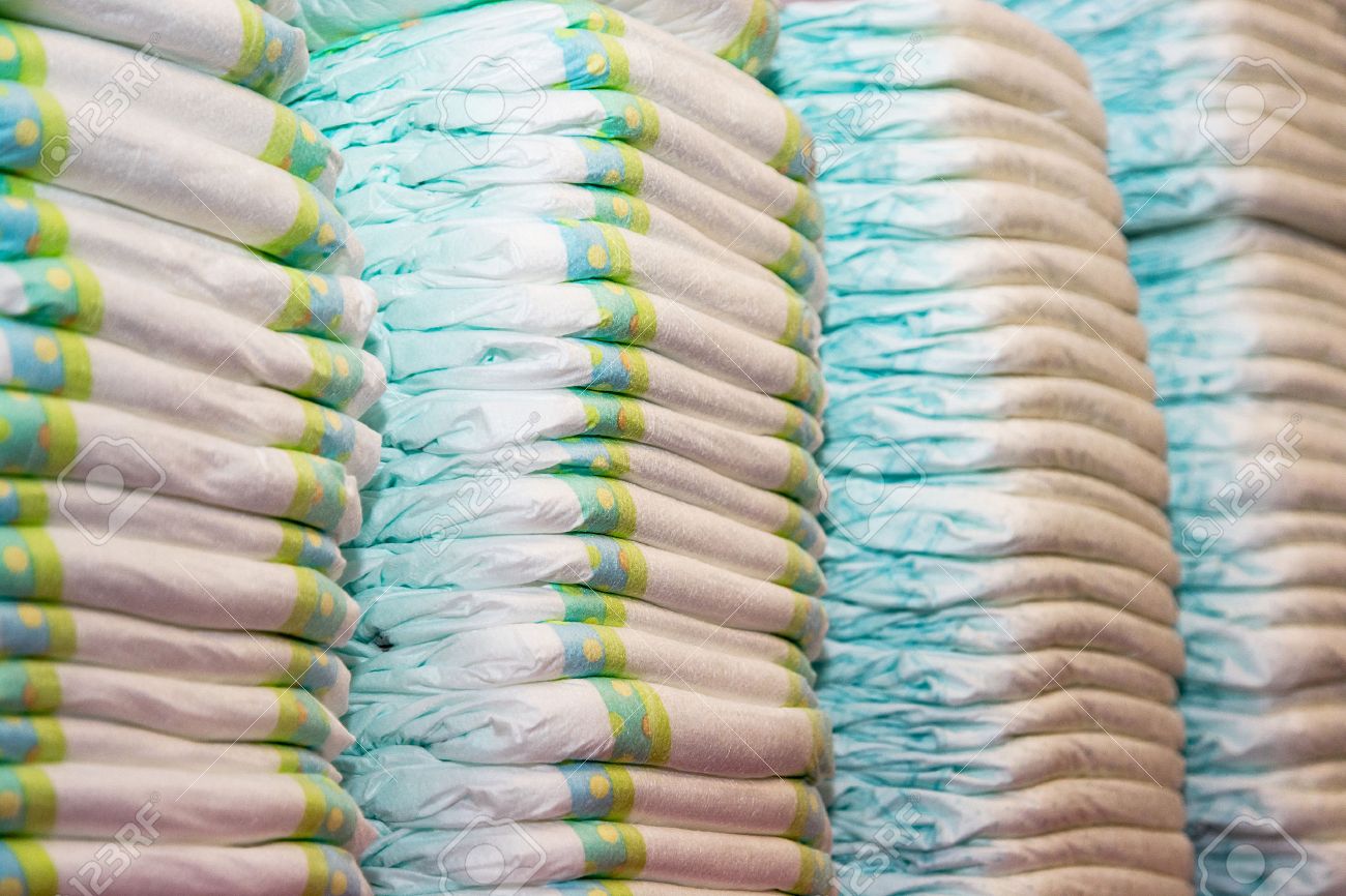 Children's diapers stacked in a piles in the child room. - 33902107 Children's diapers stacked in a piles in the child room. - 33902107