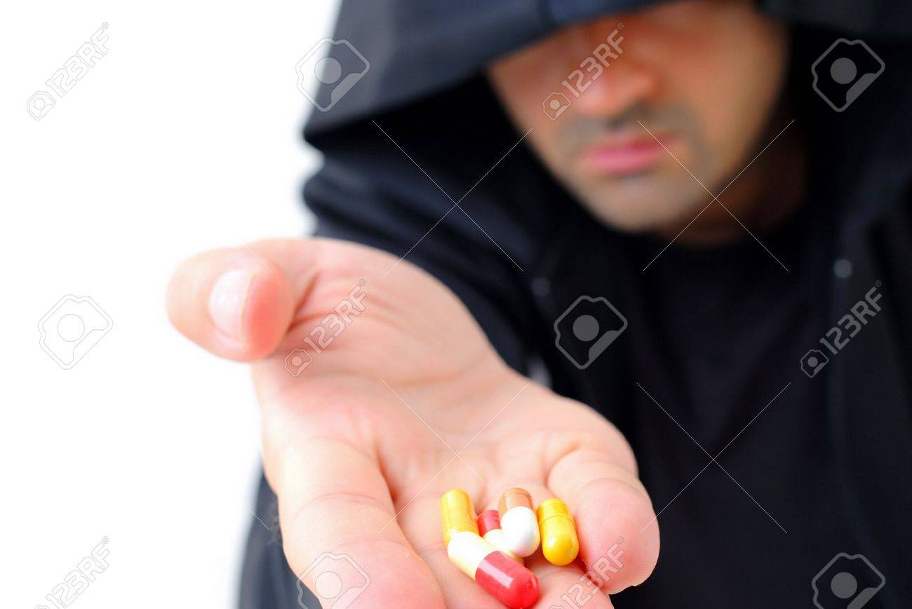 2629173-dealer-man-offering-drugs-or-medicines-.jpg