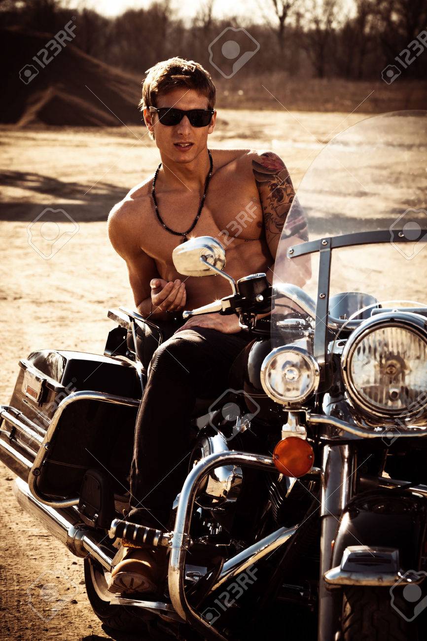 38911246-handsome-muscular-young-man-on-a-motorcycle-summer-day-at-sunset.jpg