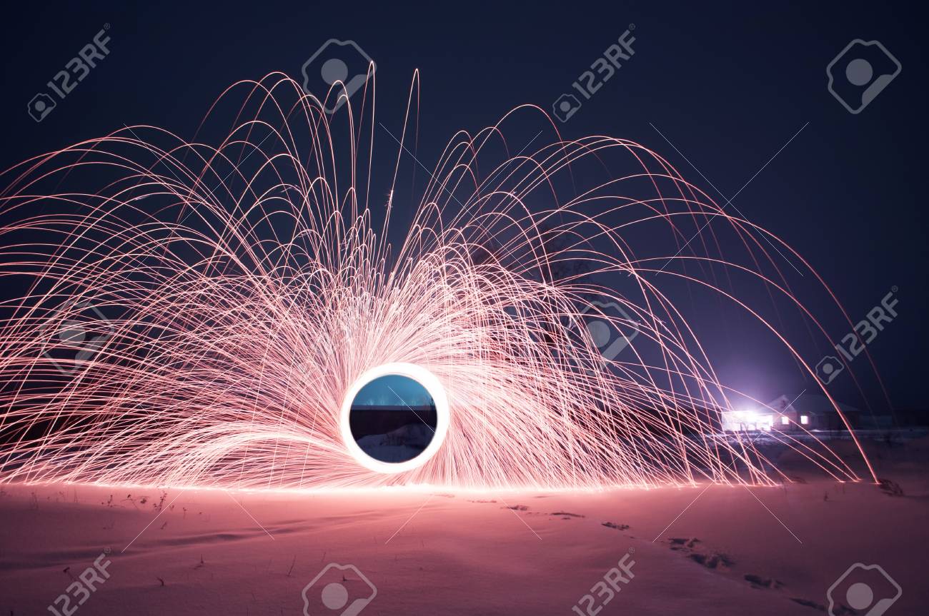 Steel Wool Photo, A Mysterious Portal Of Sparks In The Winter Night, A Black  Hole, Strange Things Happen This Night Stock Photo, Picture And Royalty  Free Image. Image 95467697.