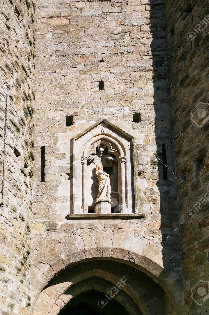 Travel To Occitanie France Statue Of Madonna In Wall Of Basilica Of Saints Nazarius And Celsus Eglise Saint Nazaire De Carcassonne Basilique Saint Nazaire In Cite De Carcassonne Stock Photo Picture And