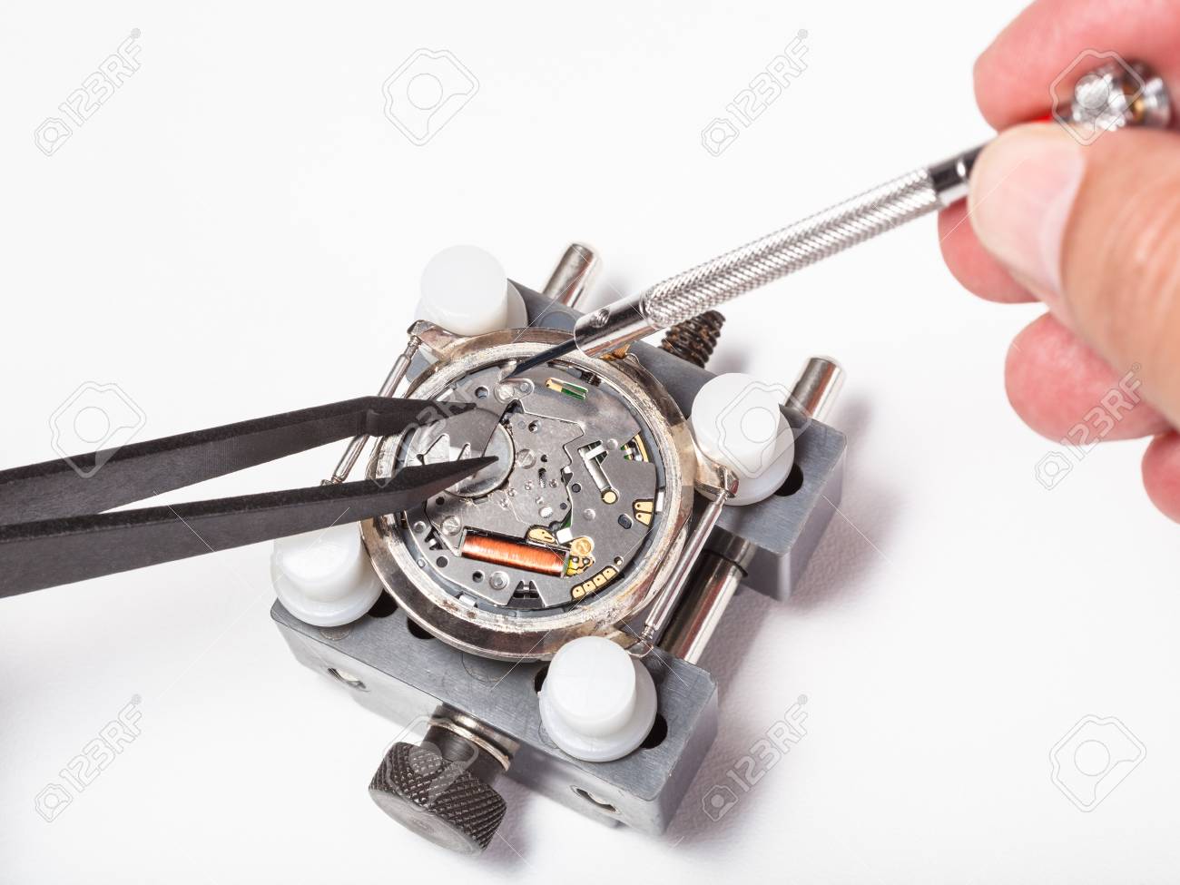 watchmaker workshop - replacement battery in quartz watch close up on white background - 83864443 watchmaker workshop - replacement battery in quartz watch close up on white background - 83864443