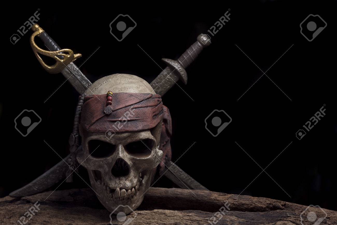 Pirate Skull With Two Swords Over Darkness Background Still Life Stock Photo Picture And Royalty Free Image Image