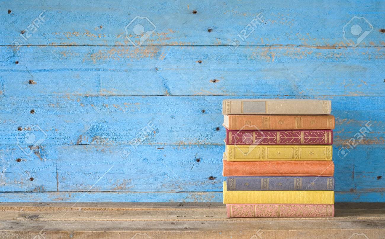 colorful books on a wooden shelf, free copy space - 30113780 colorful books on a wooden shelf, free copy space - 30113780