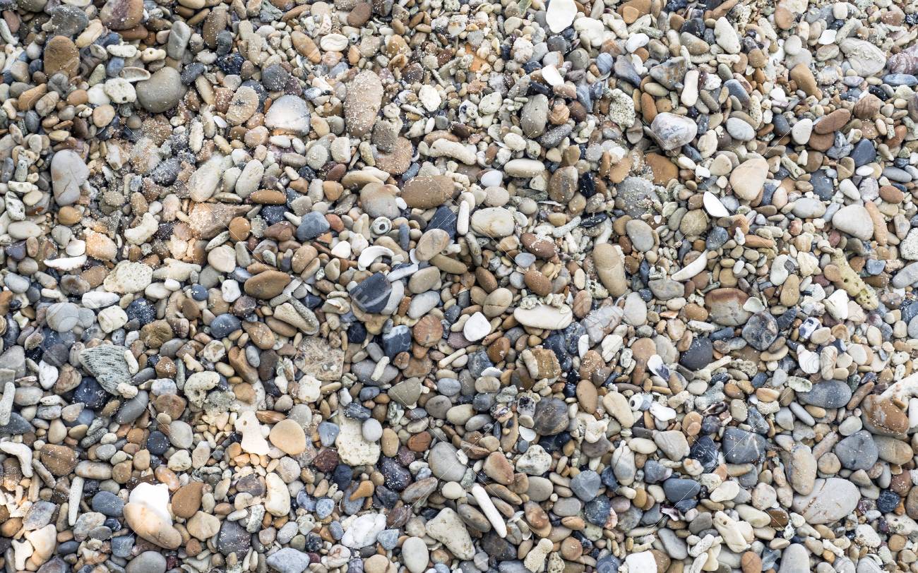 the pebbles on the beach it is a natural background stock photo
