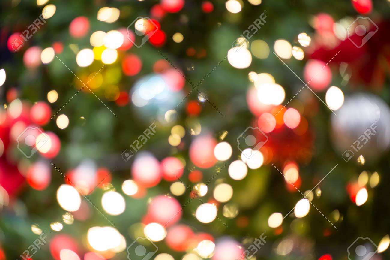 colorful red yellow and green christmas tree bokeh background of red green christmas