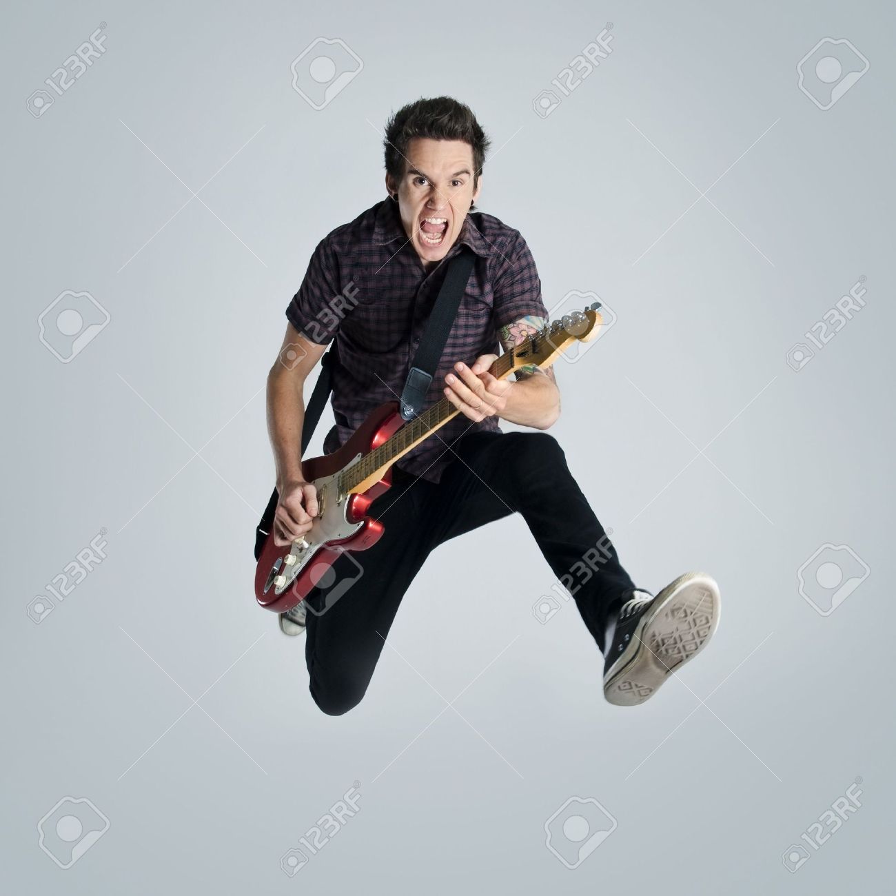awesome guitar player jumps