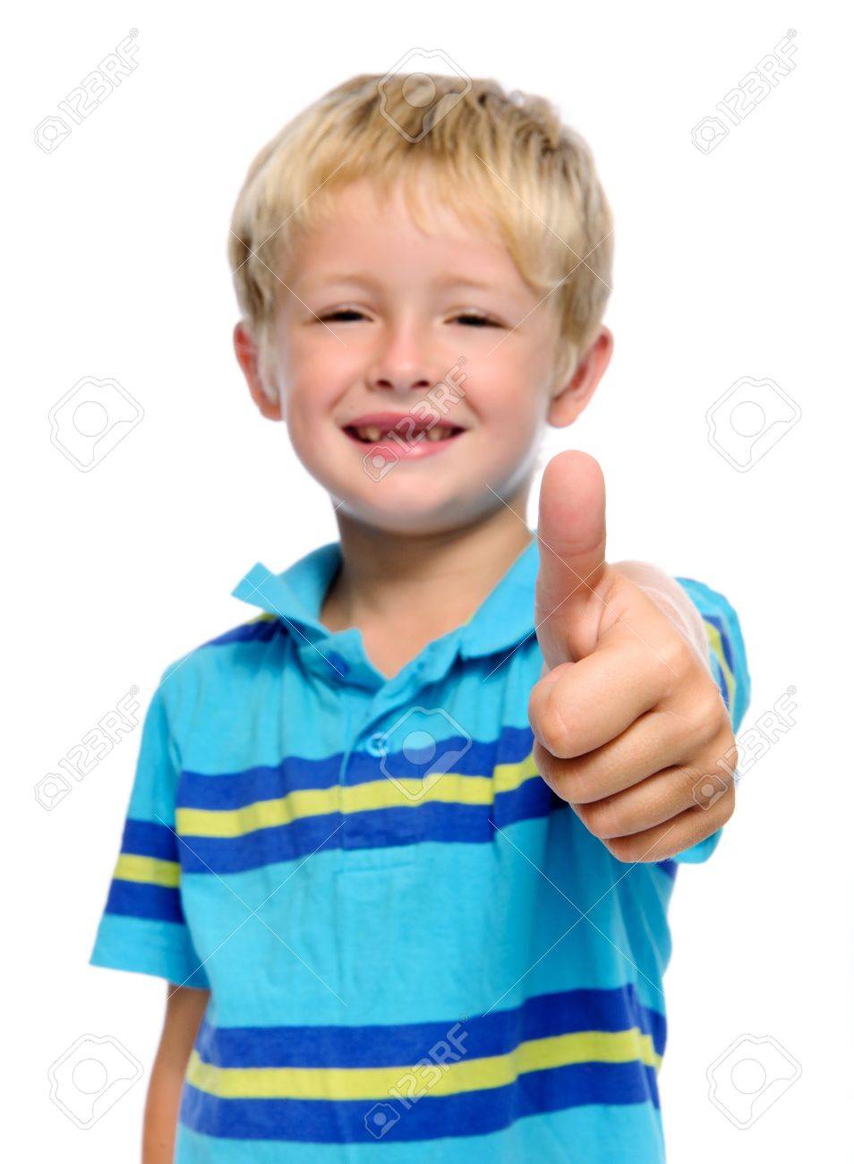 Happy Young Boy Has His Thumbs Up Selective Focus On Hand Stock