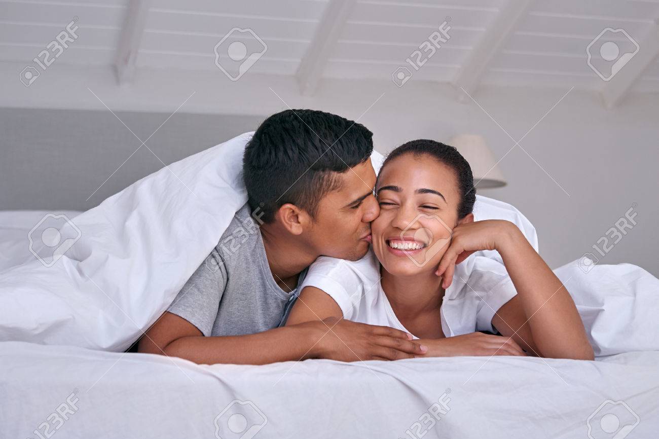 Romantic Young Affectionate Happy Married Couple In Love Kiss