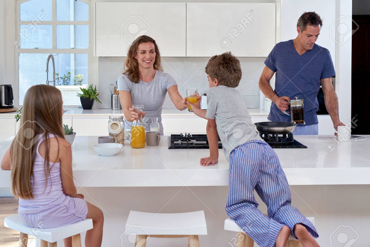 happy smiling caucasian family in the kitchen having breakfast - 49223897 happy smiling caucasian family in the kitchen having breakfast - 49223897