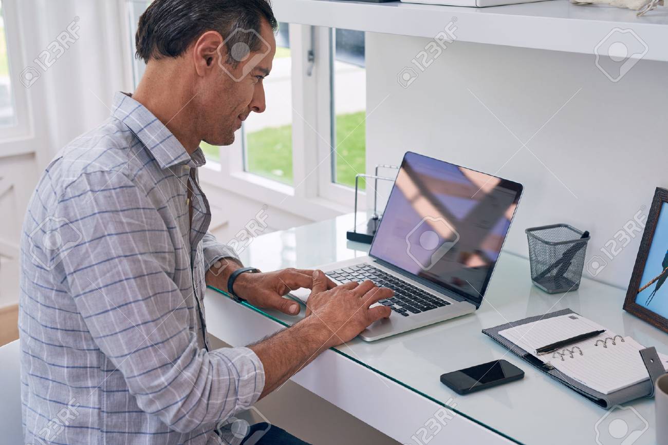 business man entrepreneur working on laptop from home office space - 49224020 business man entrepreneur working on laptop from home office space - 49224020