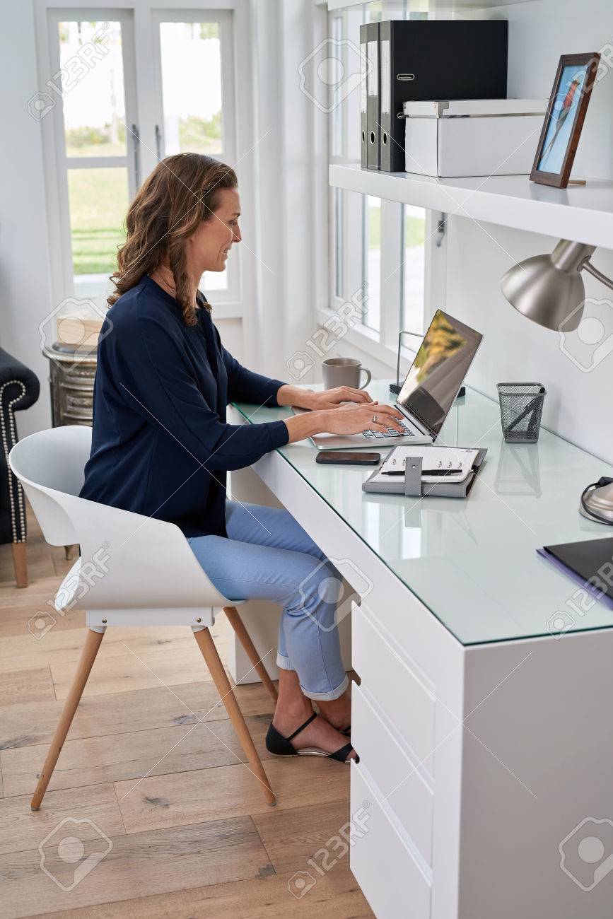 businesswoman entrepreneur working on laptop from home office space - 49227847 businesswoman entrepreneur working on laptop from home office space - 49227847