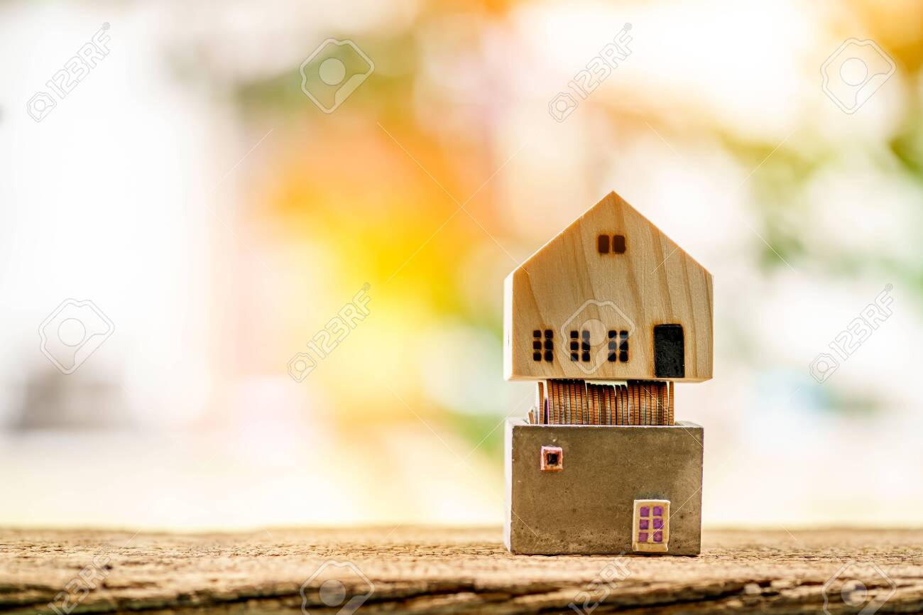 Wooden House Model Put On The Cement Bank With Gold Coin Inside Stock Photo Picture And Royalty Free Image Image 153498679