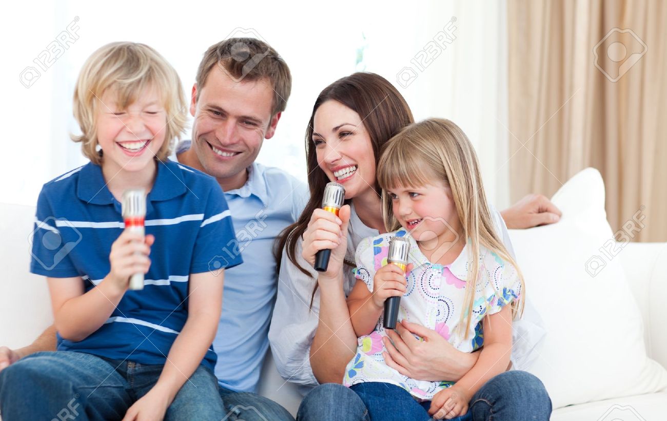 Laughing family singing together - 10097228 Laughing family singing together - 10097228