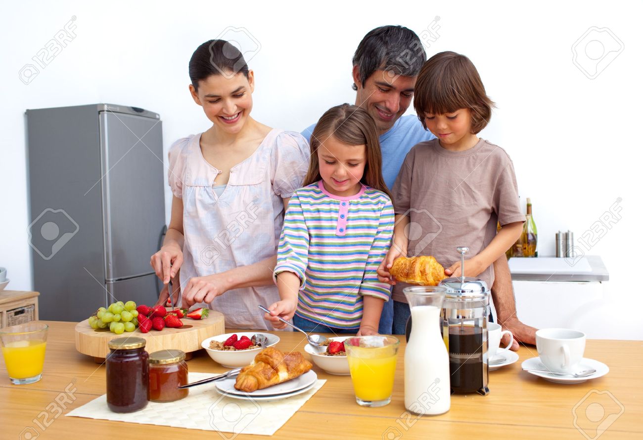 Cheerful family having a breakfast - 10134163 Cheerful family having a breakfast - 10134163