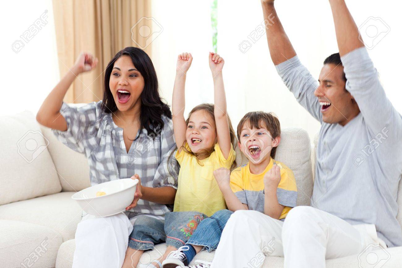 Animated family watching TV on sofa - 10095219 Animated family watching TV on sofa - 10095219
