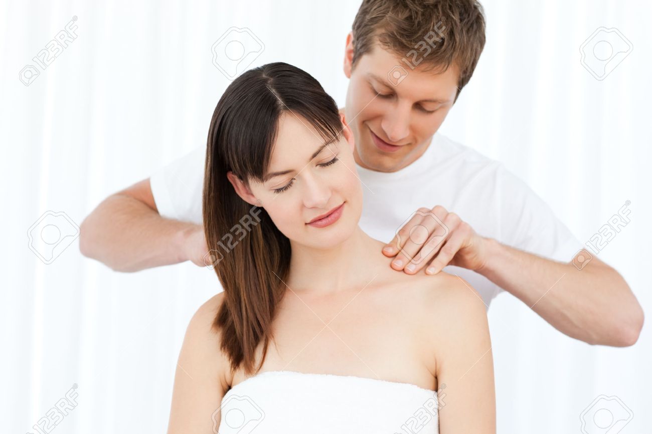 Giving Massage To His Wife Stock Photo
