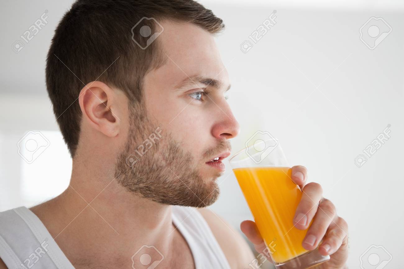 Healthy Man Drinking Orange Juice 