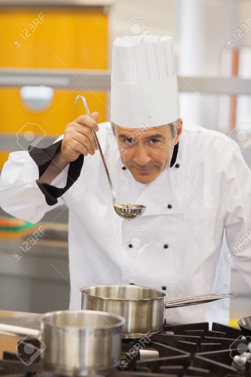 Chef Tasting His Soup In Kitchen Stock 