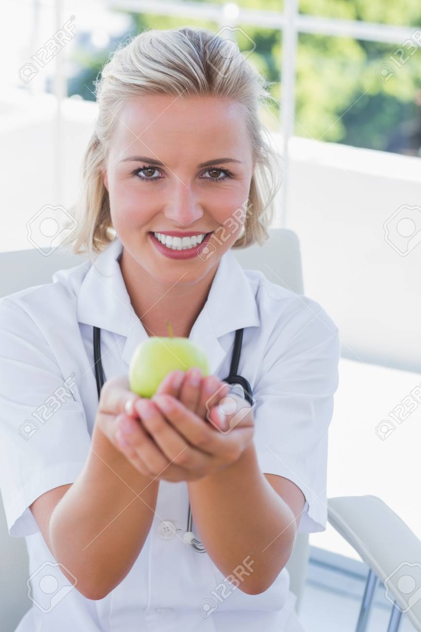 pretty blonde nurse holding