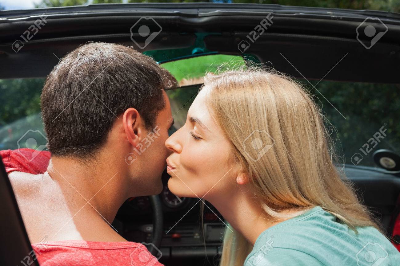 Attractive Blonde Kissing Her Boyfriend In Classy Convertible Stock Photo,  Picture and Royalty Free Image. Image 25745663.