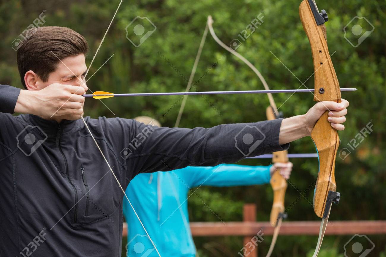 Handsome Man Practicing Archery At The 
