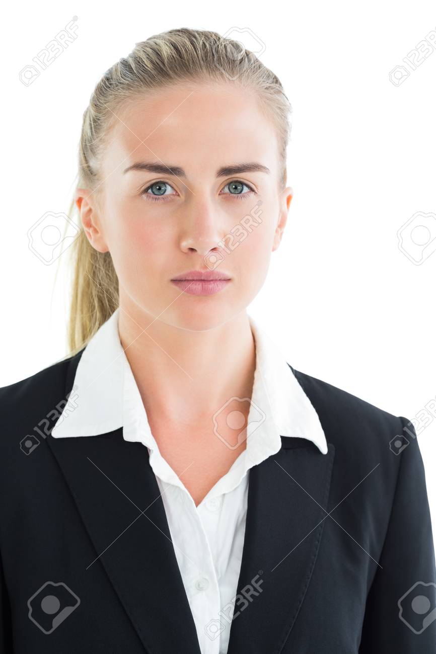 白い背景の上のカメラを見て深刻なごつい顔の実業家 の写真素材 画像素材 Image