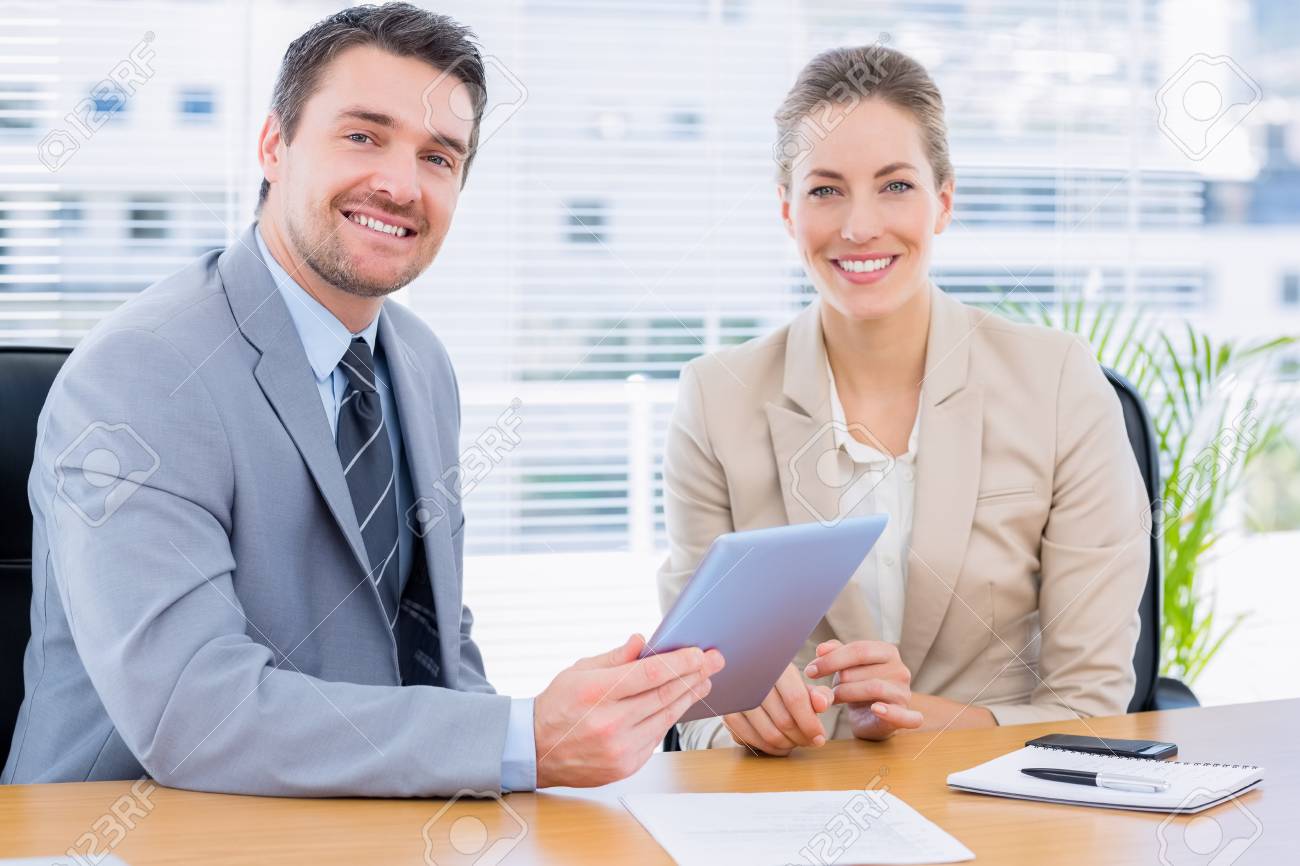 Smartly Dressed Young Man And Woman In A Business Meeting At Stock Photo Picture And Royalty Free Image Image 28380597