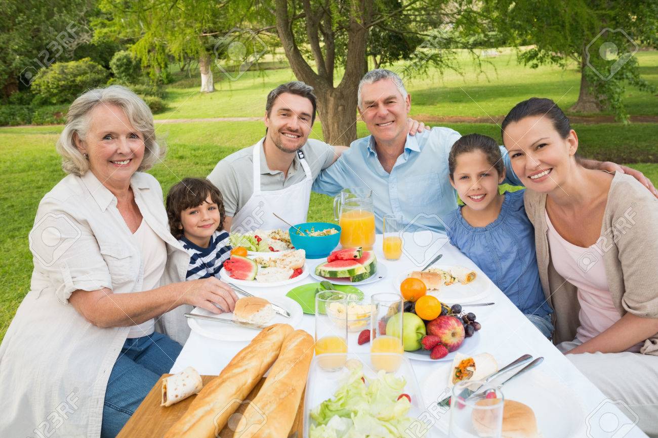 Portrait Of Extended Family Dining At Outdoor Table Stock Photo, Picture  and Royalty Free Image. Image 27076483.