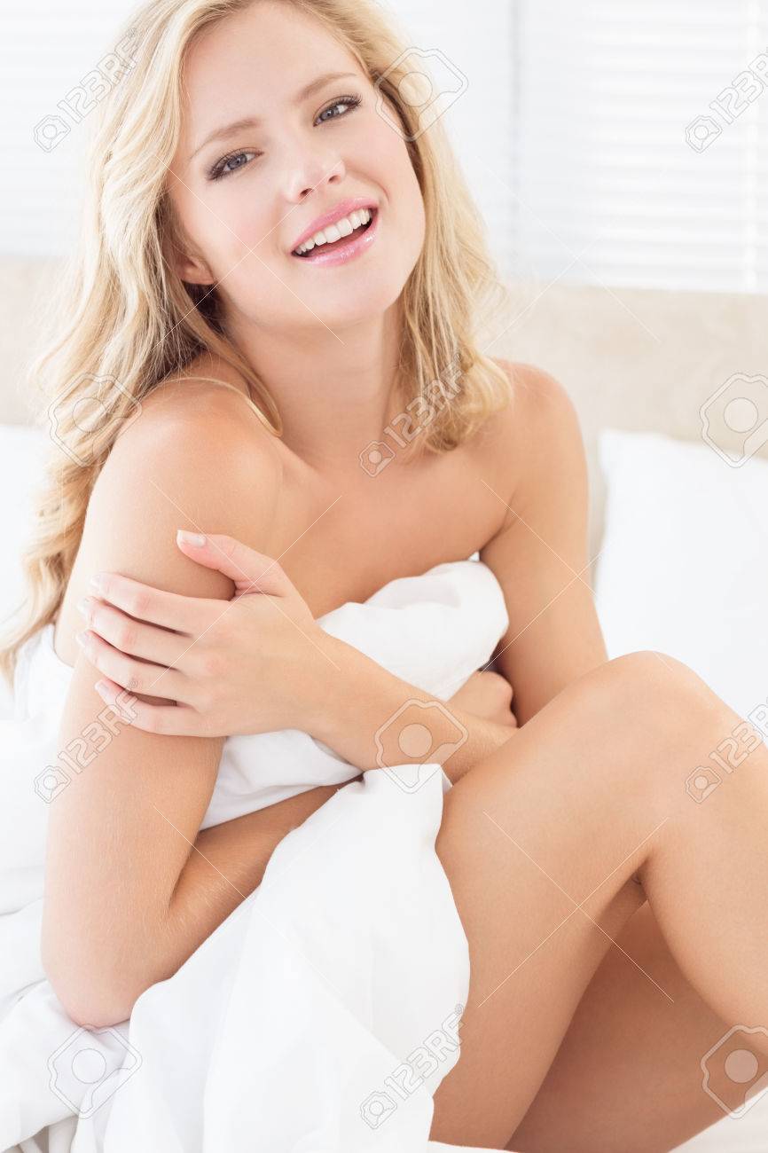 Wavebreak Media LTDSexy Smiling Young Blonde Covering