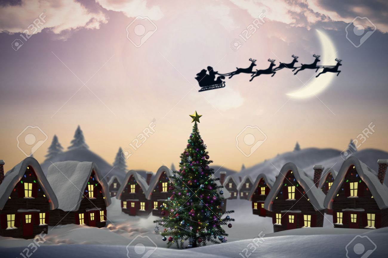 Silhouette Of Santa Claus And Reindeer Against Cute Christmas Village With Tree Stock Photo