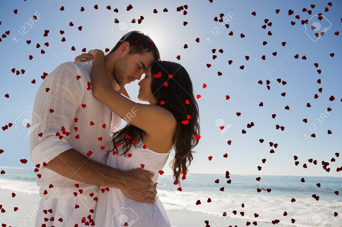 Romantic Couple Embracing Against Red Love Hearts Stock Photo, Picture and  Royalty Free Image. Image 35895893., image size:1300x866