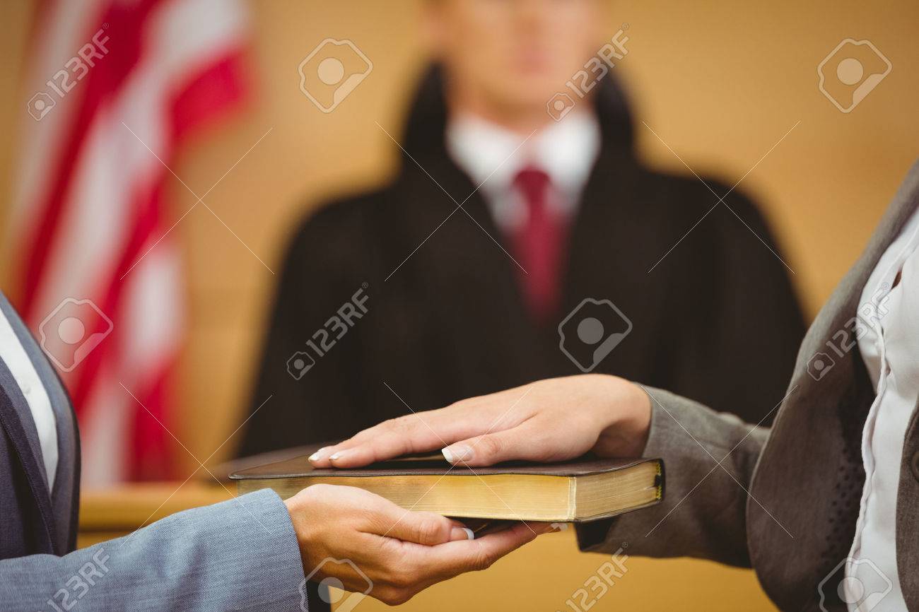 Witness Swearing On The Bible Telling The Truth In The Court - 
