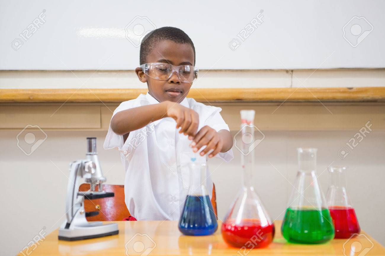 Cute pupil looking at liquids at elementary school - 38333184 Cute pupil looking at liquids at elementary school - 38333184