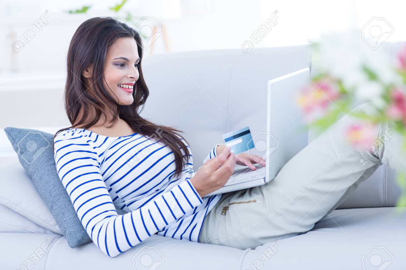 Smiling Beautiful Brunette Doing Online Shopping On The Couch Stock Photo Picture And Royalty Free Image Image 38492629