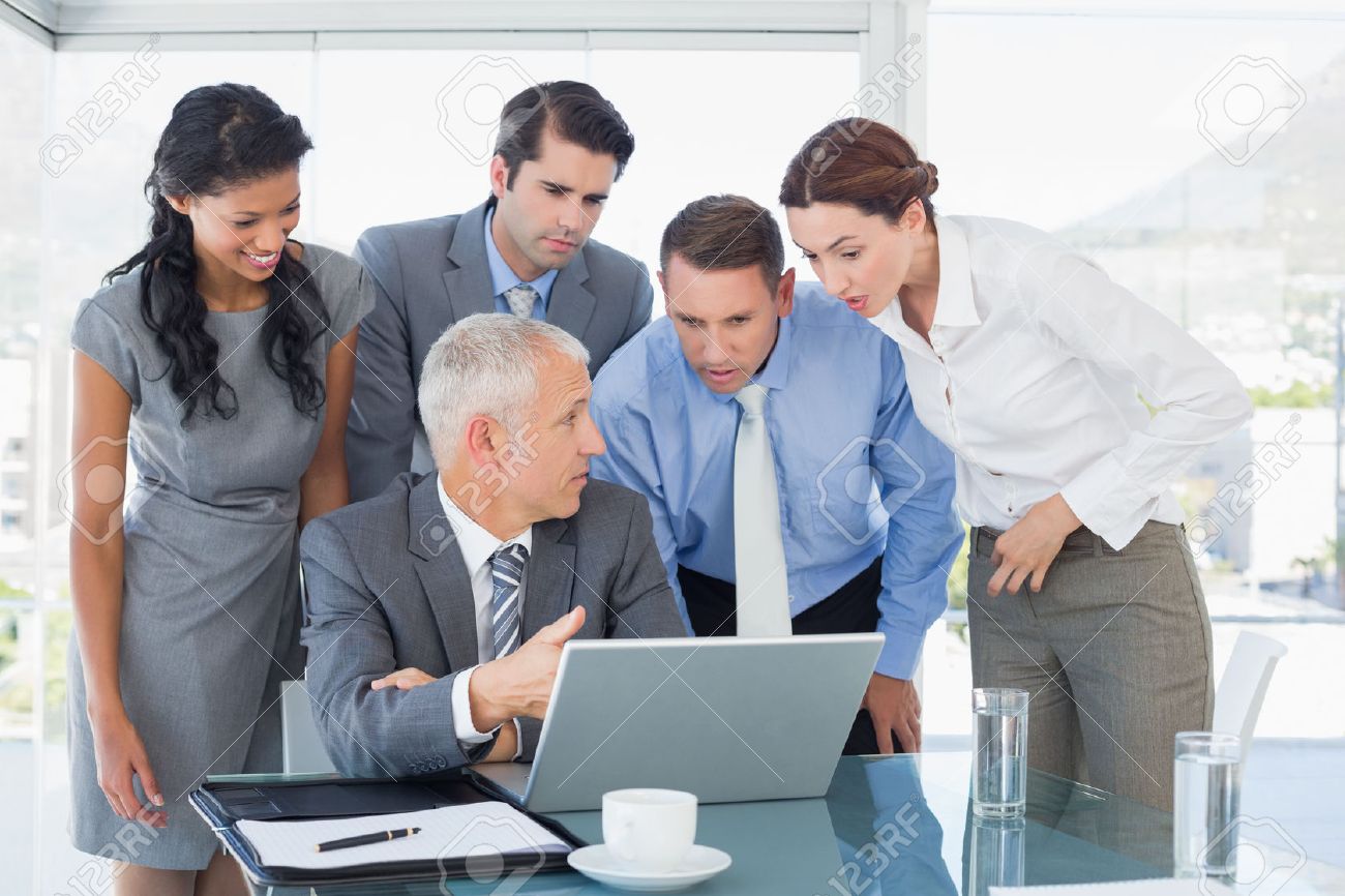 Business Team Working Together On Laptop In The Office Stock Photo, Picture And Royalty Free Image. Image 44852678.