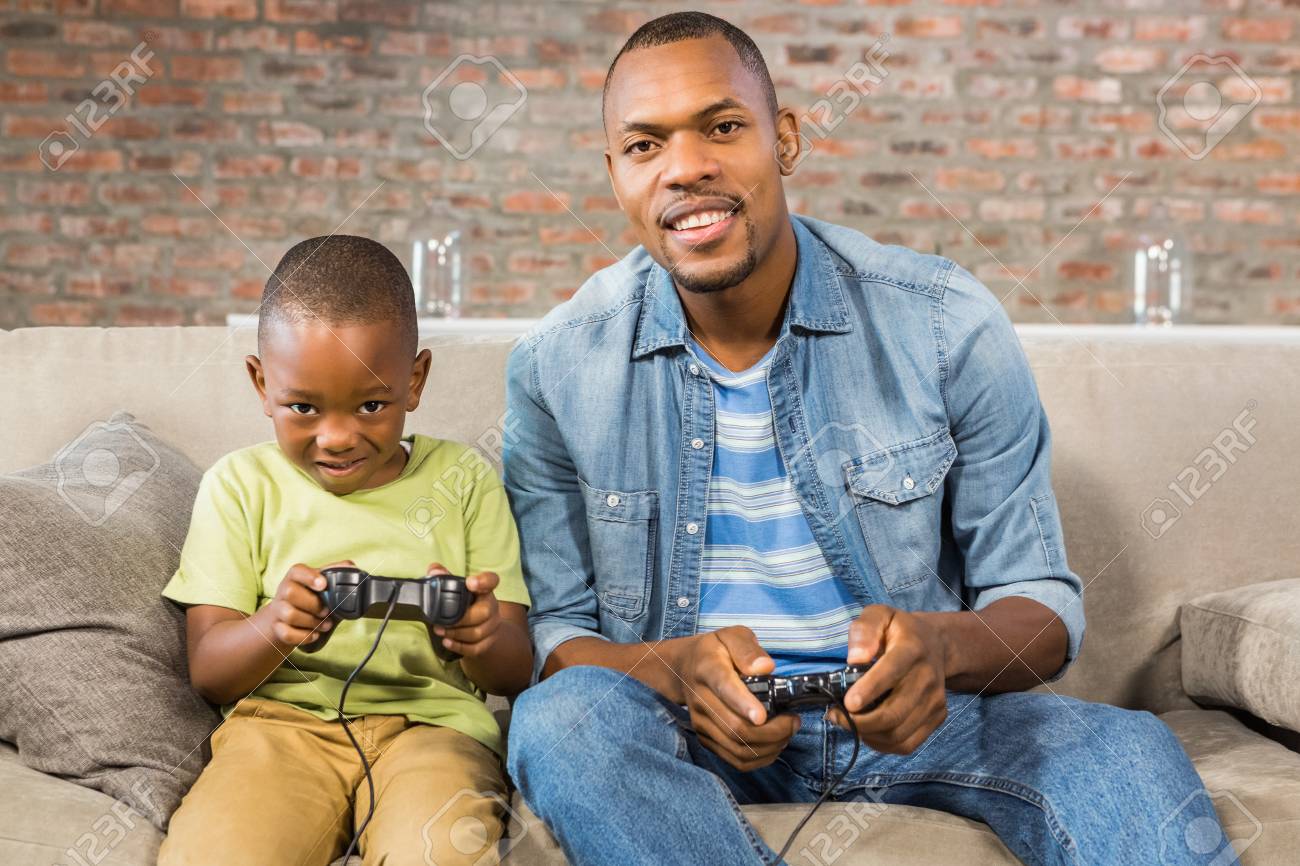 father and son playing video games