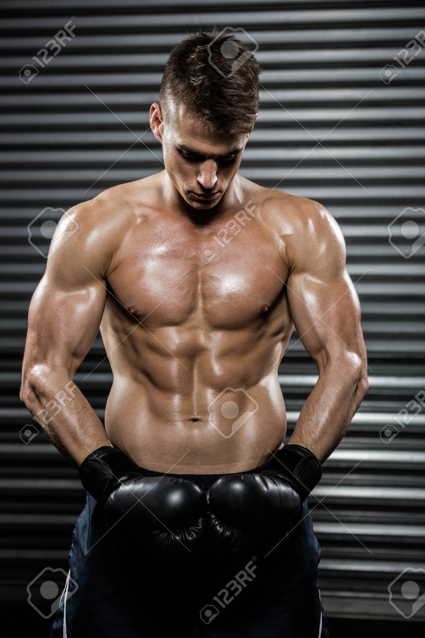 shirtless man with boxing