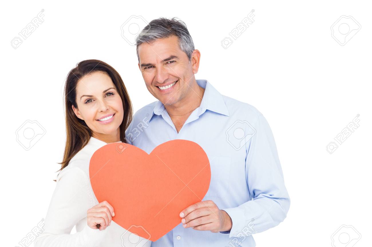 白い背景の大きな心を持って素敵なカップル の写真素材 画像素材 Image