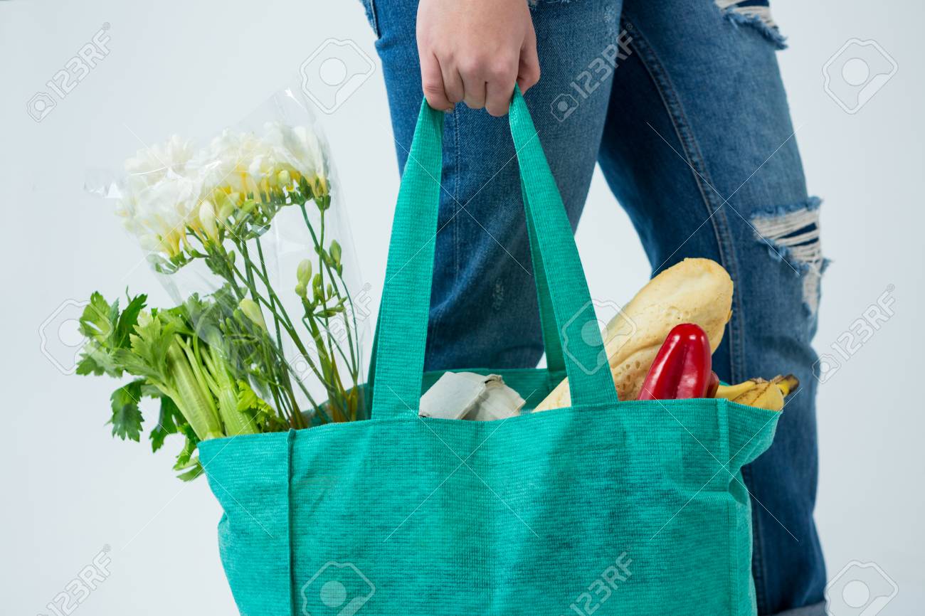 Mid Section Of Woman Carrying Grocery 